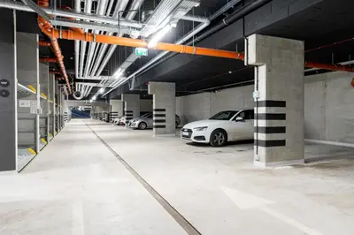 a group of cars parked in a parking garage at Dabie Park Residence in Kraków