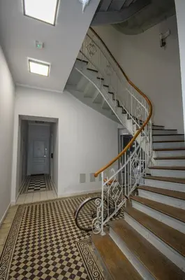 a white bedroom with a large bed and a window at InPoint Wielopole 32 Boutique Apartments Old Town&Kazimierz District Self Check-in in Kraków