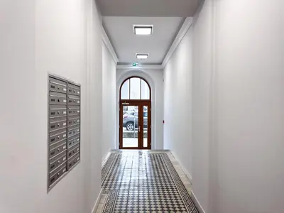 a bathroom with a toilet and a glass shower at InPoint Wielopole 32 Boutique Apartments Old Town&Kazimierz District Self Check-in in Kraków