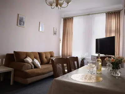 a living room with a couch and a table at 555 Flat - 55 m² mieszkanie, 5 min - Dworzec Główny in Kraków