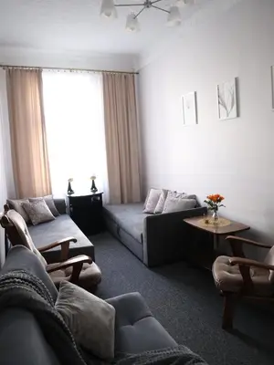a living room with a couch and a table at 555 Flat - 55 m² mieszkanie, 5 min - Dworzec Główny in Kraków