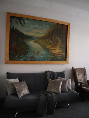a painting above a couch in a living room at 555 Flat - 55 m² mieszkanie, 5 min - Dworzec Główny in Kraków