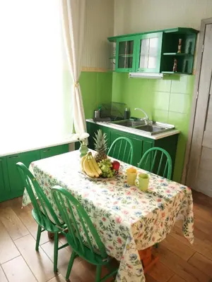 a kitchen with a table with a bowl of fruit on it at 555 Flat - 55 m² mieszkanie, 5 min - Dworzec Główny in Kraków