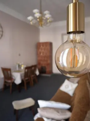 a light hanging over a couch in a living room at 555 Flat - 55 m² mieszkanie, 5 min - Dworzec Główny in Kraków