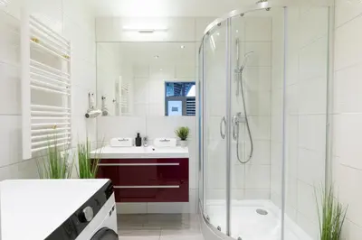 a bathroom with a shower and a sink at Rainbow Apartments Old Town in Kraków