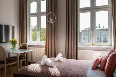 a hotel room with a bed and a window at Amazing apartament in the heart of Kazimierz in Kraków