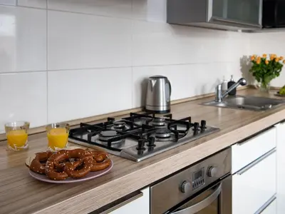 a plate of pretzels on a stove in a kitchen at Amazing apartament in the heart of Kazimierz in Kraków