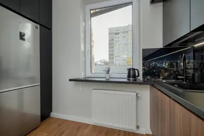 a kitchen with a sink and a window at Home Office - 2-Bedroom Apartment Corpo-Stay in Kraków by Noclegi Renters in Kraków