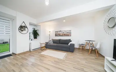 a living room with a couch and a table at Apart-Studio Close Wawel Castle in Kraków