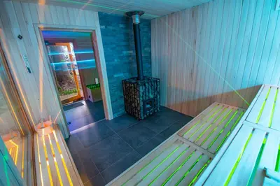 an empty room with a wood stove in a room at Cyrhel Apartments in Zawoja