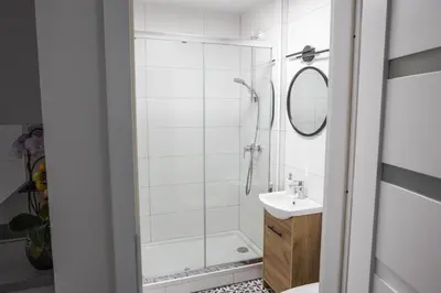 a bathroom with a shower and a sink at CracWoW K8 No.11 Apartment in Kraków
