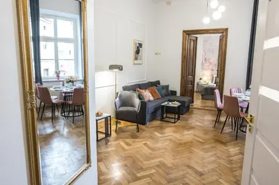 a living room with a couch and a table at CracWoW K8 No.11 Apartment in Kraków