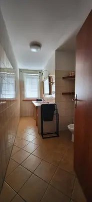 a bathroom with a sink and a toilet at La Casa De Roland in Wieliczka