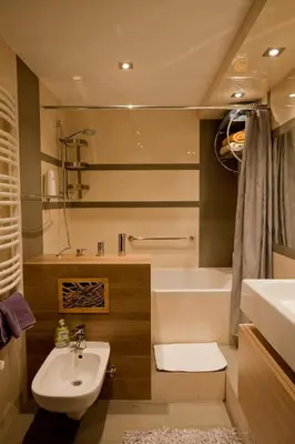 a bathroom with a sink and a toilet and a tub at Magic Apartment in Kraków