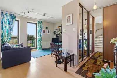 a living room with a couch and a table at Bronowice - large and modern apartment with free parking spot in Kraków