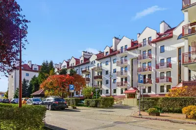 a row of apartment buildings on a street at Bronowice - large and modern apartment with free parking spot in Kraków