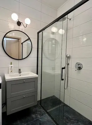 a bathroom with a shower and a sink and a mirror at FeelHome Apartment with kitchen in Kraków