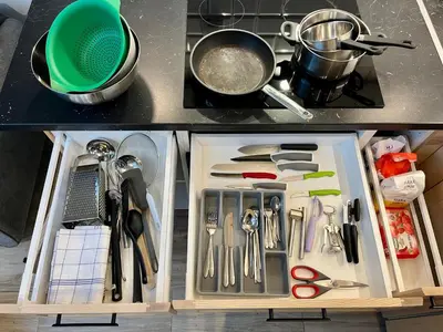 a drawer full of utensils in a kitchen at FeelHome Apartment with kitchen in Kraków