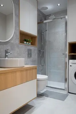 a bathroom with a toilet sink and a shower at Kraków Central Comfort Apartments by Rentujemy in Kraków