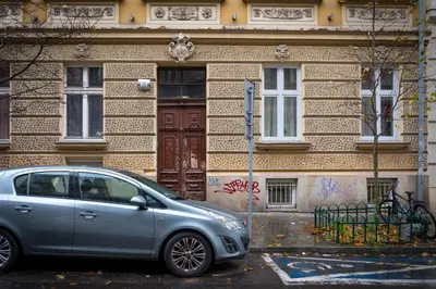 a silver car parked in front of a building at Kraków Central Comfort Apartments by Rentujemy in Kraków