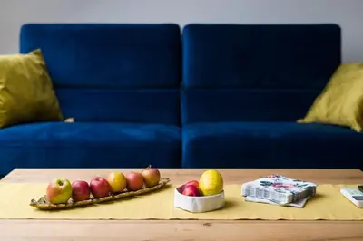 a table with a bowl of apples and a bowl of fruit at Charming apartment in perfect location in Kraków