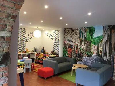 a room with a wall mural of a street at Apartamenty Lawenda in Rabka