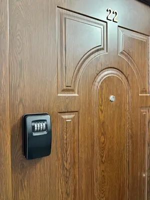 a wooden door with a clock on it at Apartment Family Dreams Old Town in Kraków