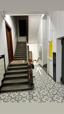 a staircase in a building with a stair case at Apartment Family Dreams Old Town in Kraków