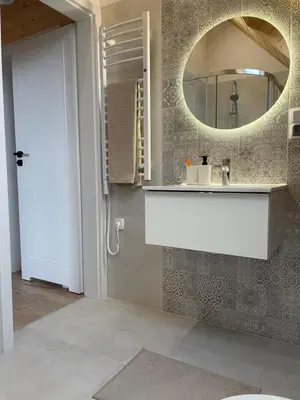 a bathroom with a sink and a mirror at Górne Chaty Zawoja in Zawoja