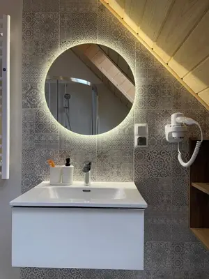 a bathroom with a white sink and a mirror at Górne Chaty Zawoja in Zawoja