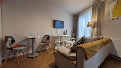 a living room with a couch and a table at Apartament Wieliczka in Wieliczka