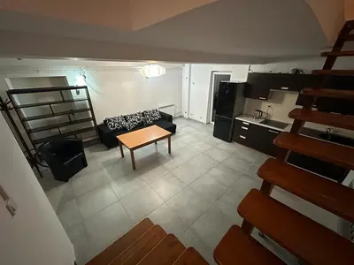 a living room with a couch and a table at Jaga Family Apartment air conditioner and free parking in Kraków