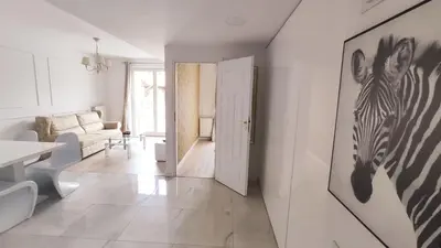 a living room with a zebra picture on the wall at Augustiańska 24 by Homeprime in Kraków