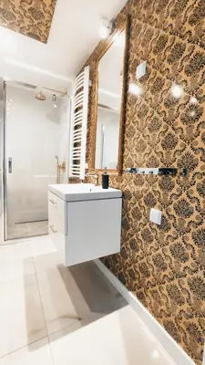 a bathroom with a white sink and a mirror at Augustiańska 24 by Homeprime in Kraków