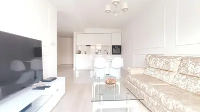 a living room with a couch and a table at Augustiańska 24 by Homeprime in Kraków