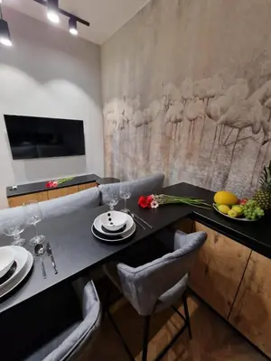 a dining room with a table and chairs at Apartamenty Sebastiana in Kraków