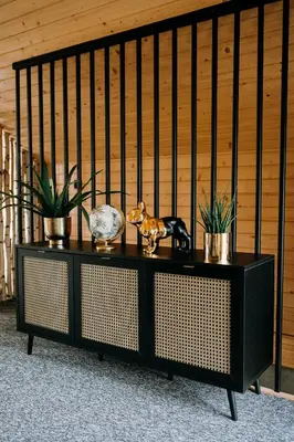 a black cabinet with some items on top of it at ArtHouse Podhale in Klikuszowa