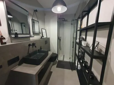 a bathroom with a sink and a glass shower at Fly_to_Cracow_18 in Kraków
