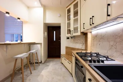 a kitchen with a stove and a counter top at Native Apartments Dietla 17 in Kraków