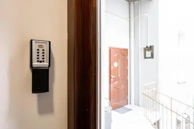 a door with a pay phone on the side of a building at Native Apartments Dietla 17 in Kraków