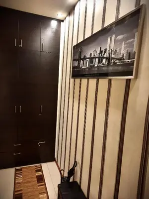 a room with a wall with a picture on it at Luxury Senate Apartment in Kraków