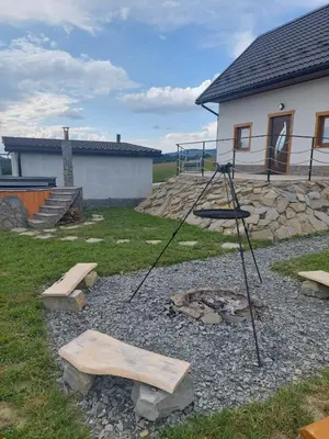 a playground with a swing and a fire pit at Skalne Rancho - BALIA, MASAŻ in Rabka-Zdroj