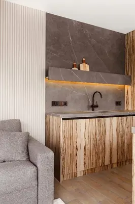 a kitchen with a sink and a couch at PANORAMA VIEW by MINT APARTMENT in Kraków