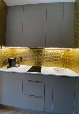a kitchen with white cabinets and a sink at Lux Stays by Torres at K39 Krakow in Kraków