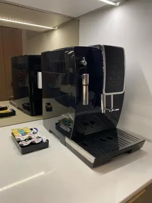 a black coffee maker sitting on top of a counter at Lux Stays by Torres at K39 Krakow in Kraków