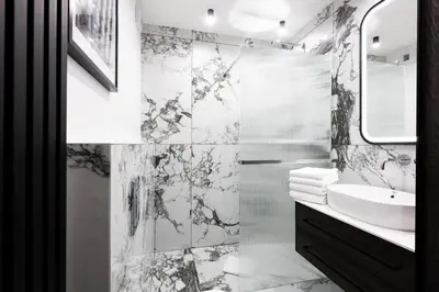 a bathroom with a sink and a mirror at Native Apartments Kościuszki 39 in Kraków