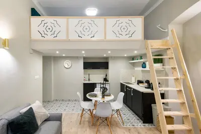 a living room and kitchen with a loft bed at Bocheńska 6 by Homeprime in Kraków