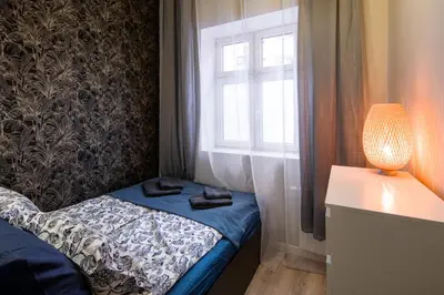 a small room with a bed and a window at Bocheńska 6 by Homeprime in Kraków