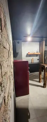 a room with a brick wall and a red bench at Design Vistula old town apartment private underground parking in Kraków