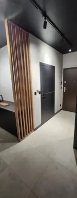 a room with a door and a room with a floor at Design Vistula old town apartment private underground parking in Kraków